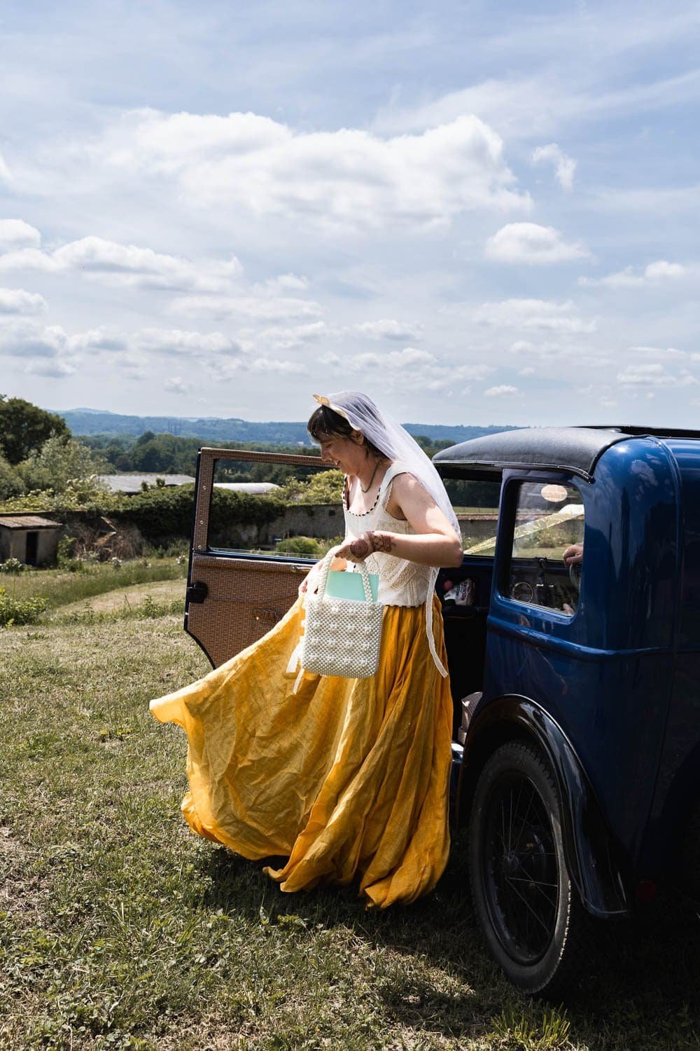 Photography of a yellow DIY wedding in a barn by London photographer Lauren Squire