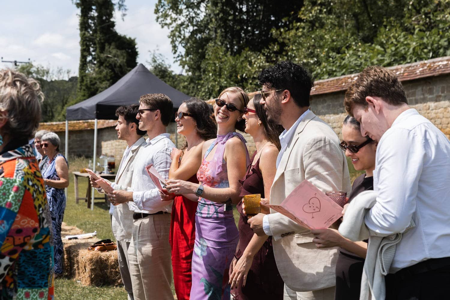 Photography of a yellow DIY wedding in a barn by London photographer Lauren Squire