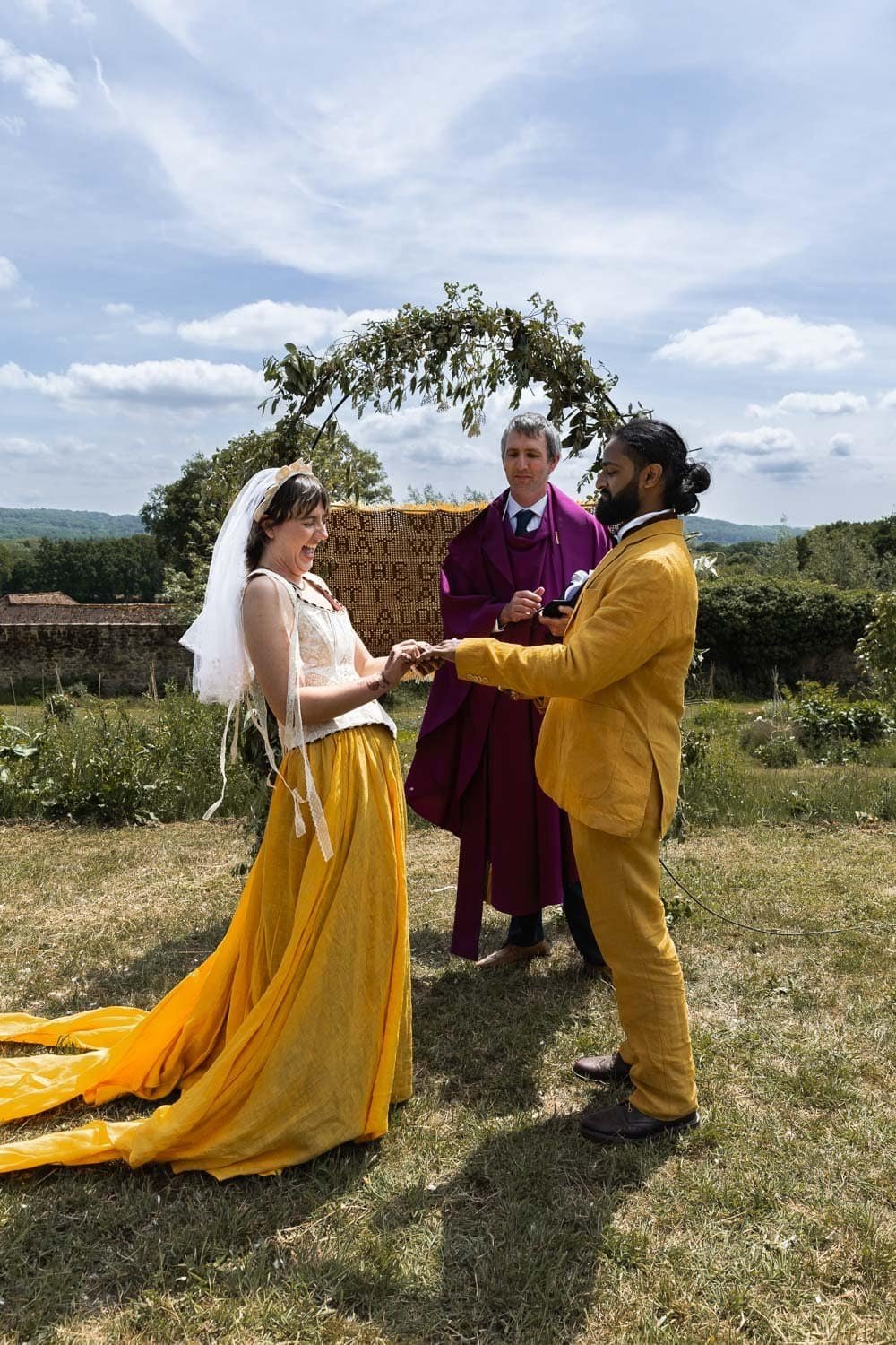 Photography of a yellow DIY wedding in a barn by London photographer Lauren Squire