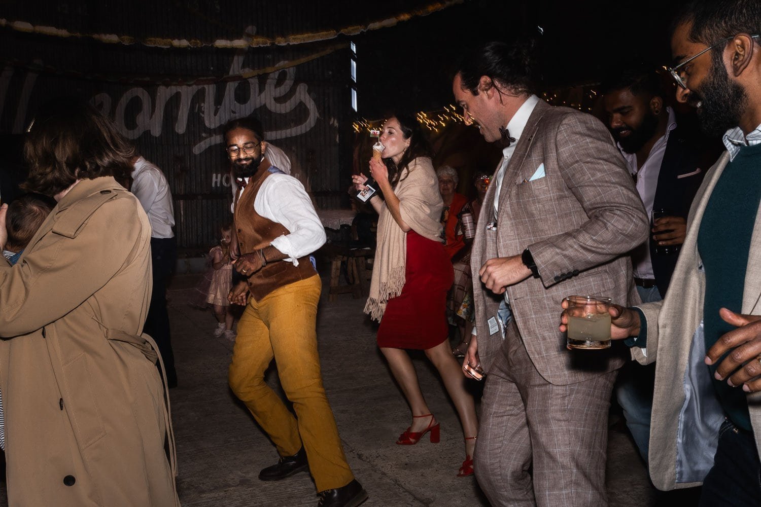 Photography of a yellow DIY wedding in a barn by London photographer Lauren Squire