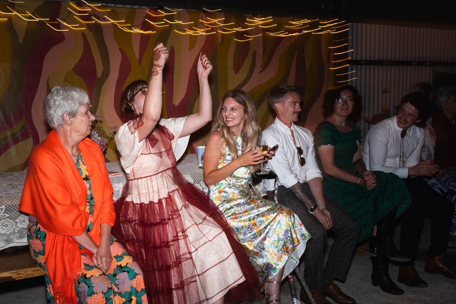 Photography of a yellow DIY wedding in a barn by London photographer Lauren Squire