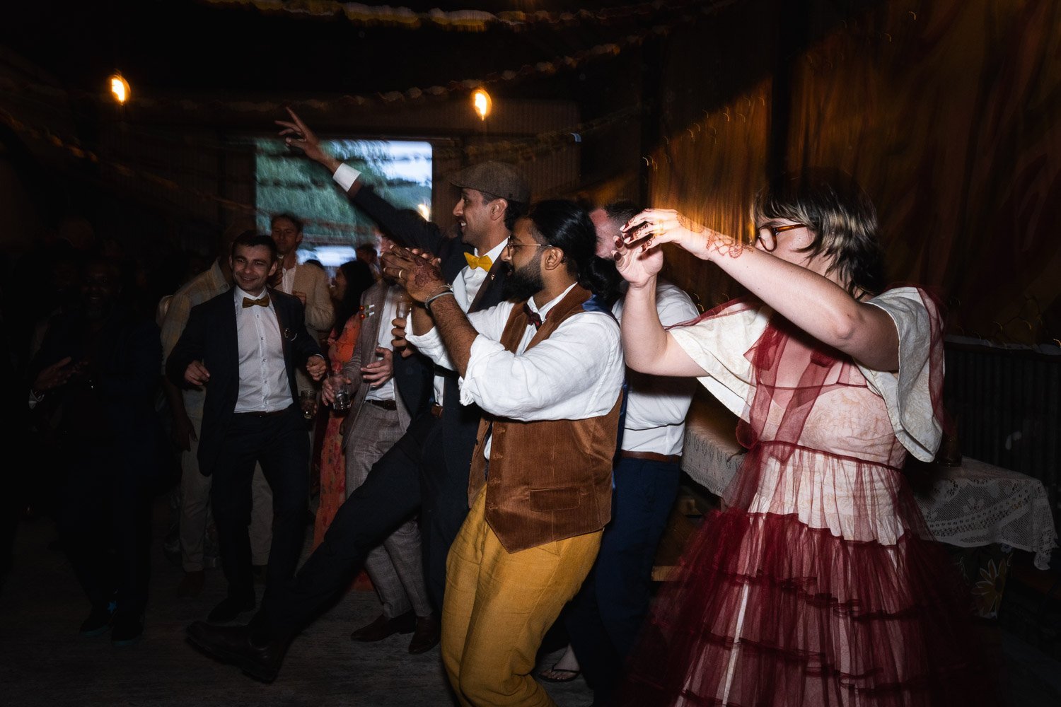 Photography of a yellow DIY wedding in a barn by London photographer Lauren Squire