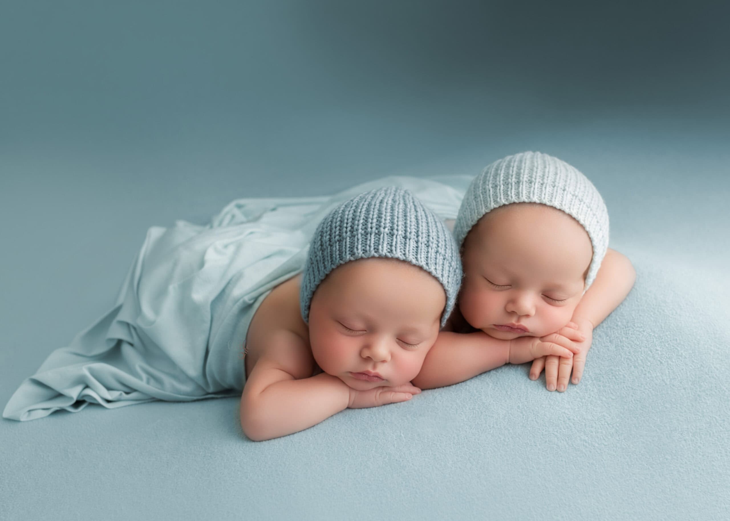 newborn twin baby girl taking newborn photos in their 30 days with Little One Photography