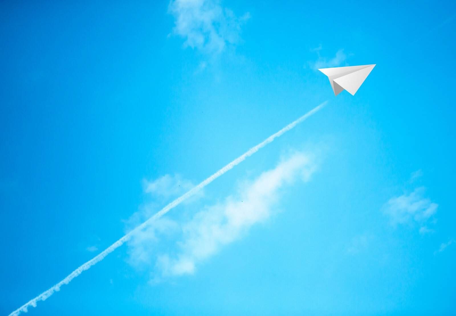 Paper airplane in the sky