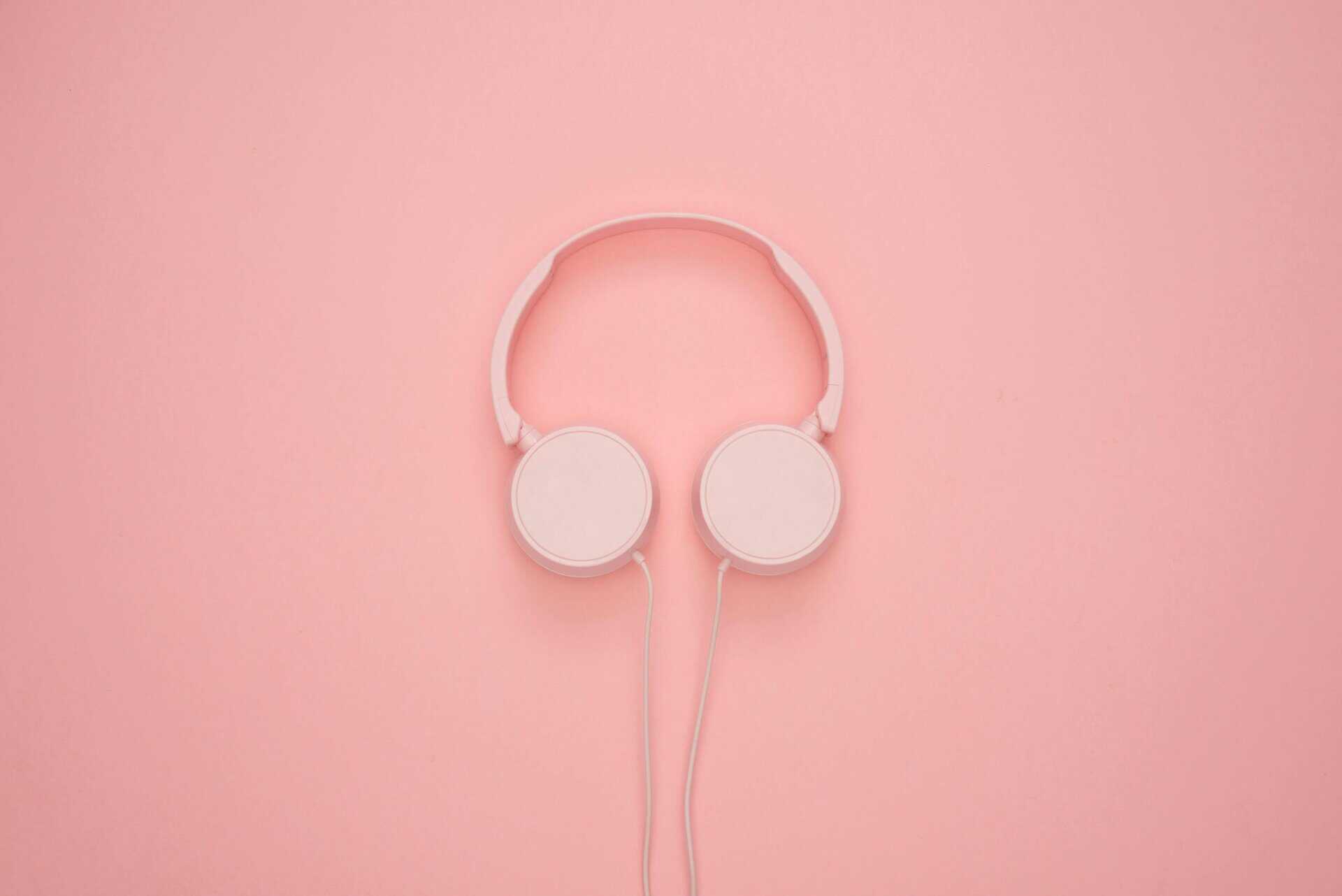what is active listening? Pink headphones to represent listening.