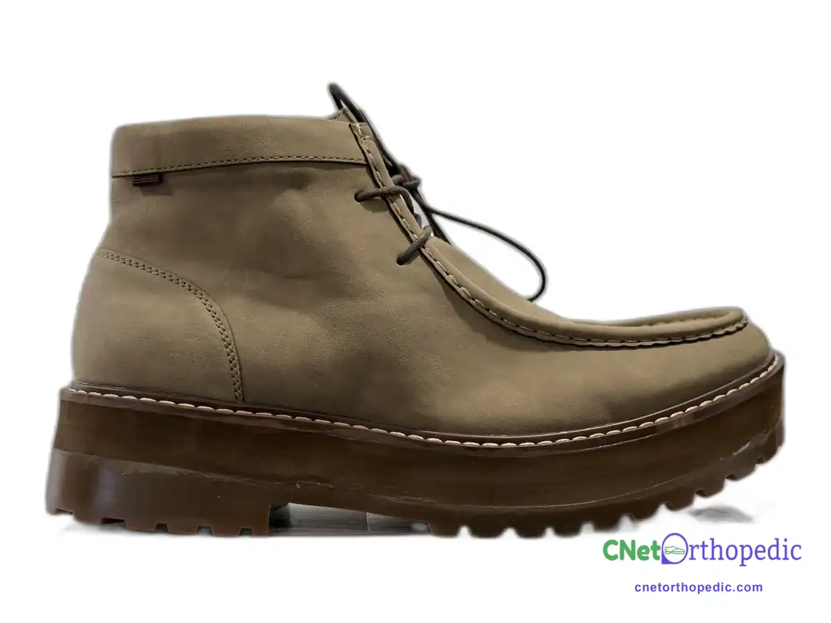 Tan Clarks leather boot with a 1 inch shoe lift built into the lug sole
