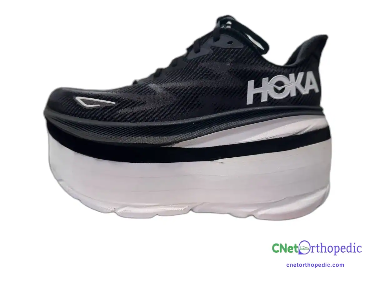 Black Hoka running shoe with a custom shoe lift built into the sole
