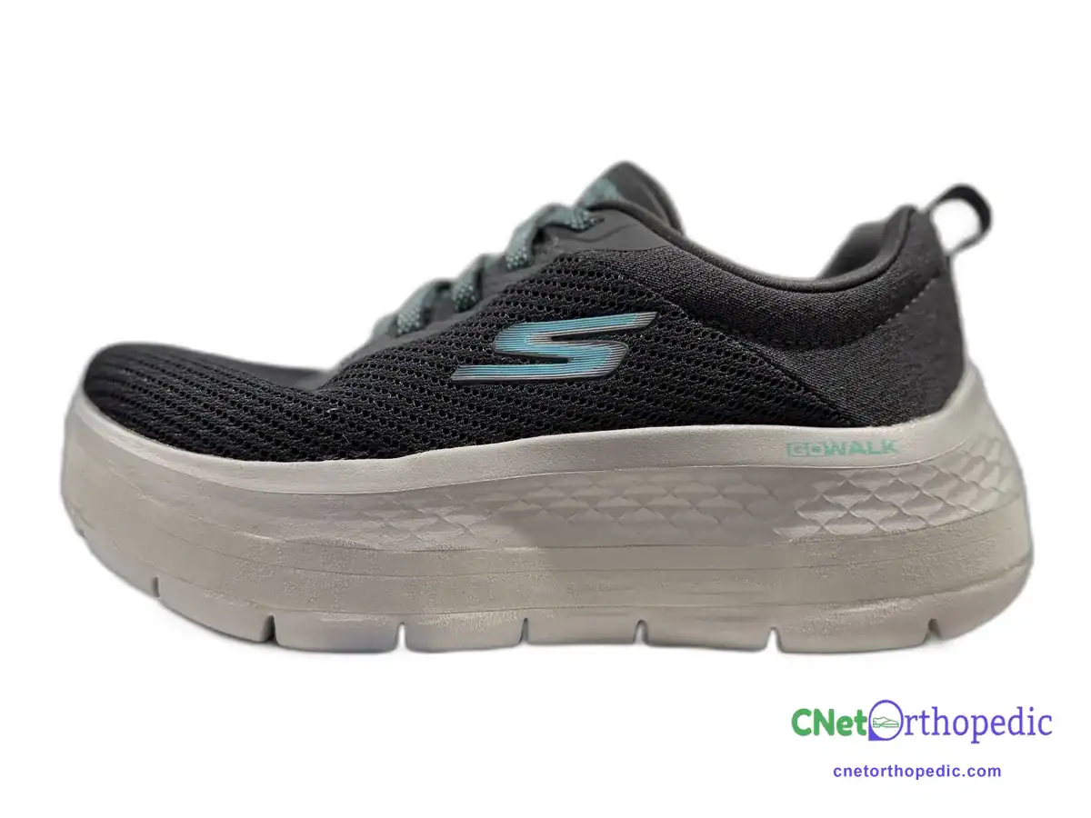 Black Skechers sneaker with a 1.5 inch white shoe lift