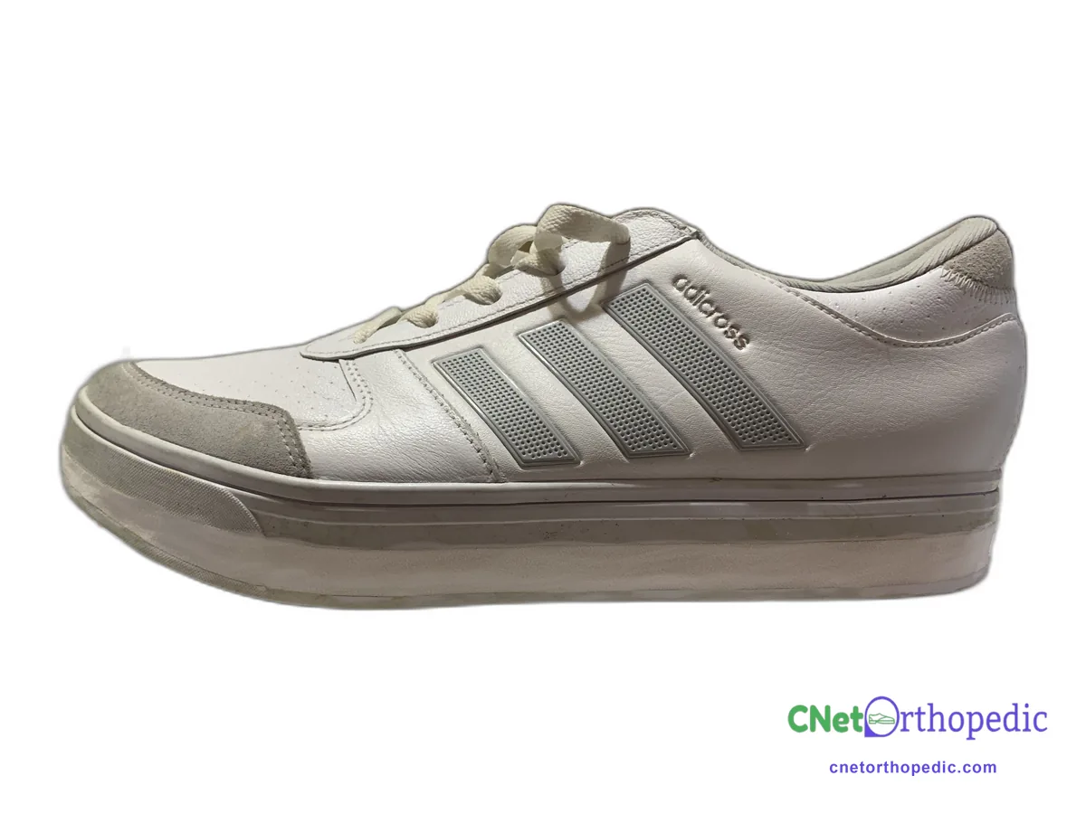 White Adidas sneaker with a 1/2 inch shoe lift