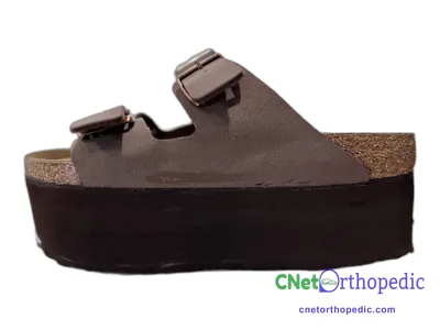 Shoe lift added to a women's brown Birkenstock sandal