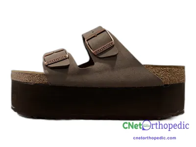 Shoe lift added to a women's brown Birkenstock sandal