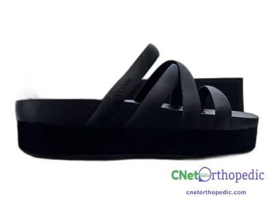 Shoe lift added to a women's black sandal