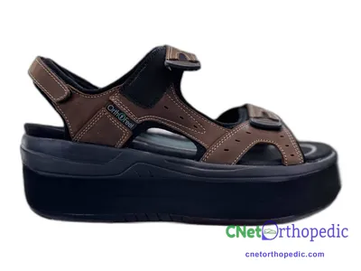 Shoe lift added to a women's black sandal