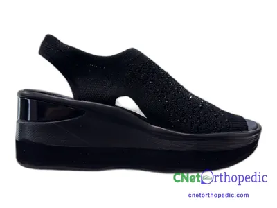 Shoe lift added to a women's black sandal