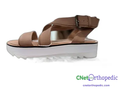 Shoe lift added to a women's brown sandal