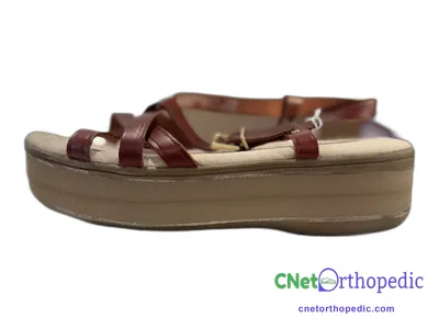 Shoe lift added to a women's brown sandal