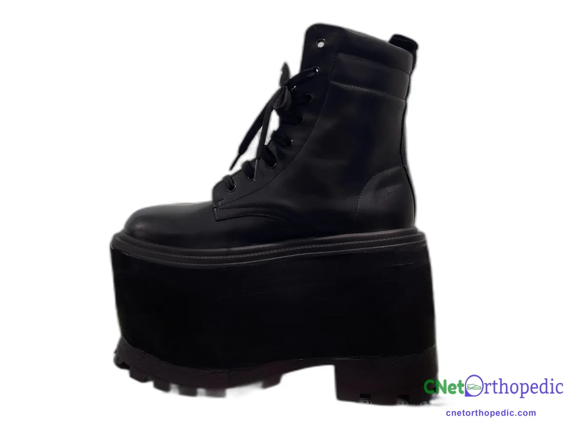 Black leather lace-up boot with a 3 inch shoe lift and wide heel base