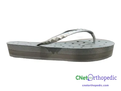 Shoe lift added to a women's white Crocs sandal