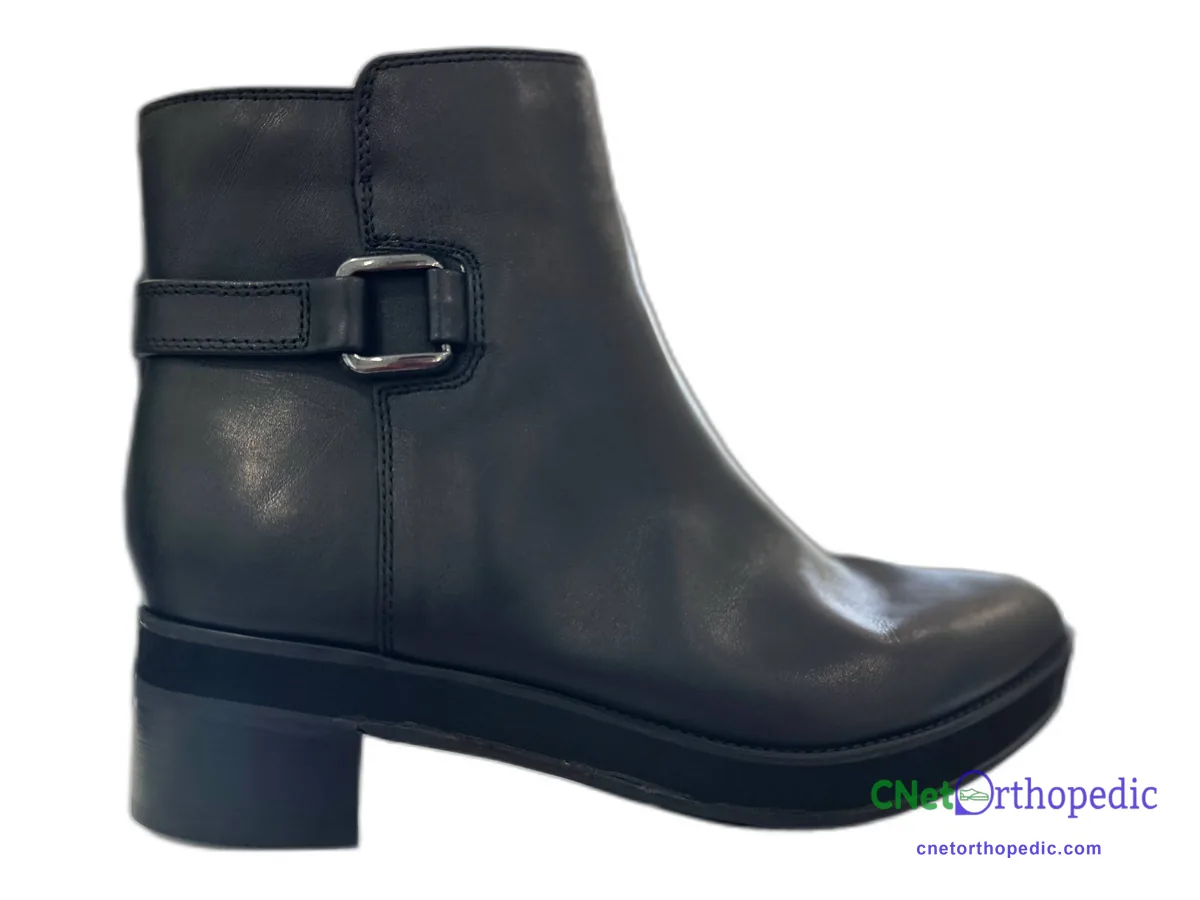 Black leather ankle boot with a 1/2 inch heel and sole build-up