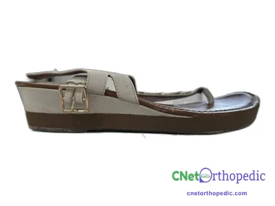 Shoe lift added to a women's grey sandal