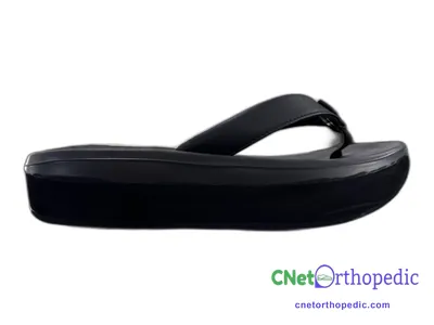 Shoe lift added to a women's black sandal