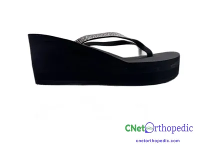Shoe lift added to a women's black sandal