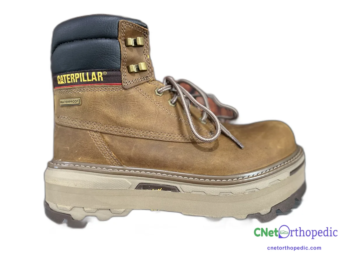Tan Caterpillar work boot with a 3/4 inch shoe lift built into the sole