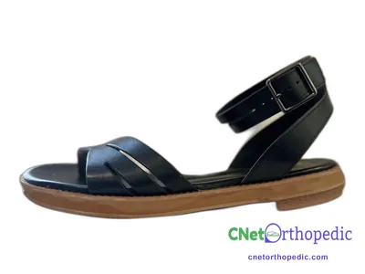 Shoe lift added to a black sandal