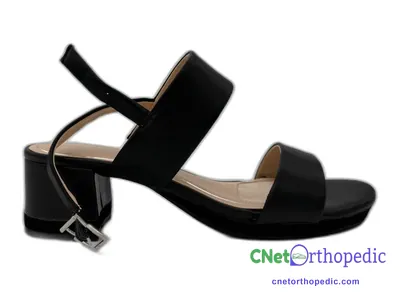 Shoe lift added to a black sandal