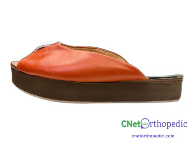 Shoe lift added to a women's orange sandal
