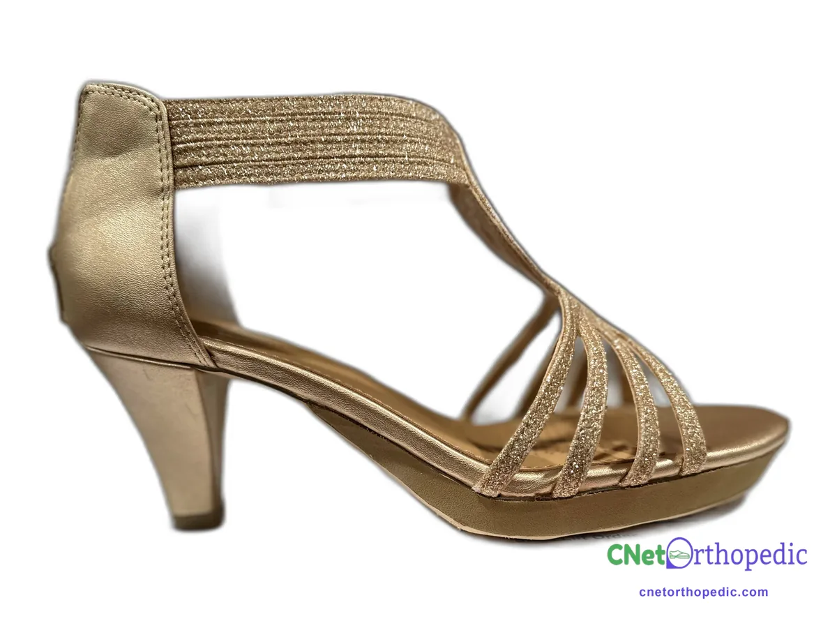 Gold strappy heeled sandal with a small shoe lift built into the sole