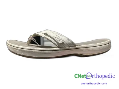 Shoe lift added to a women's white sandal