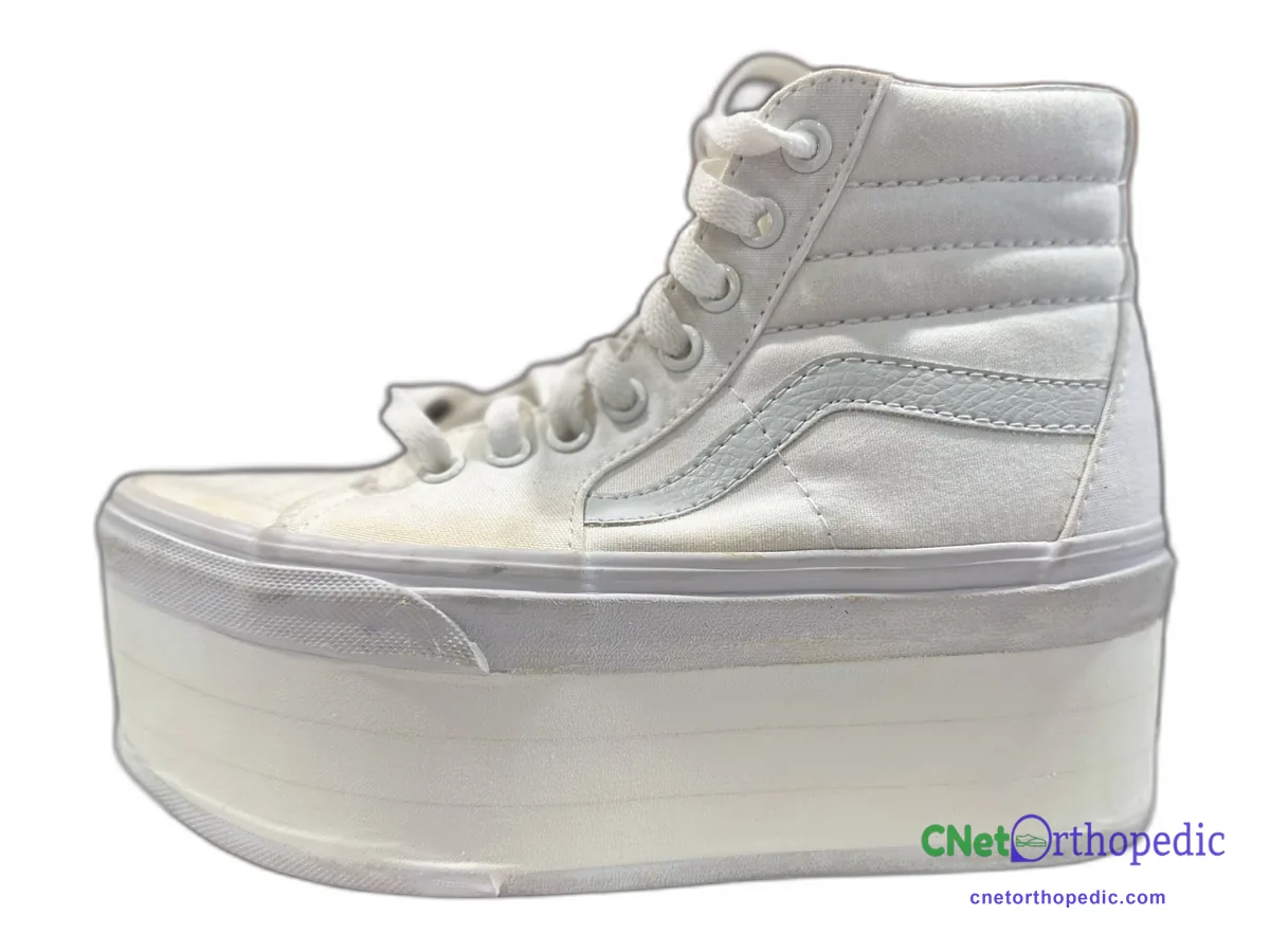 White Vans high-top with a 3 inch white shoe lift