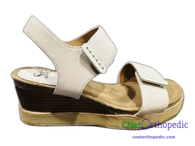 Shoe lift added to a women's white Sanita sandal