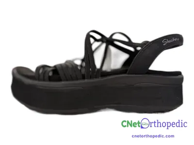 Shoe lift added to a women's black Skechers sandal