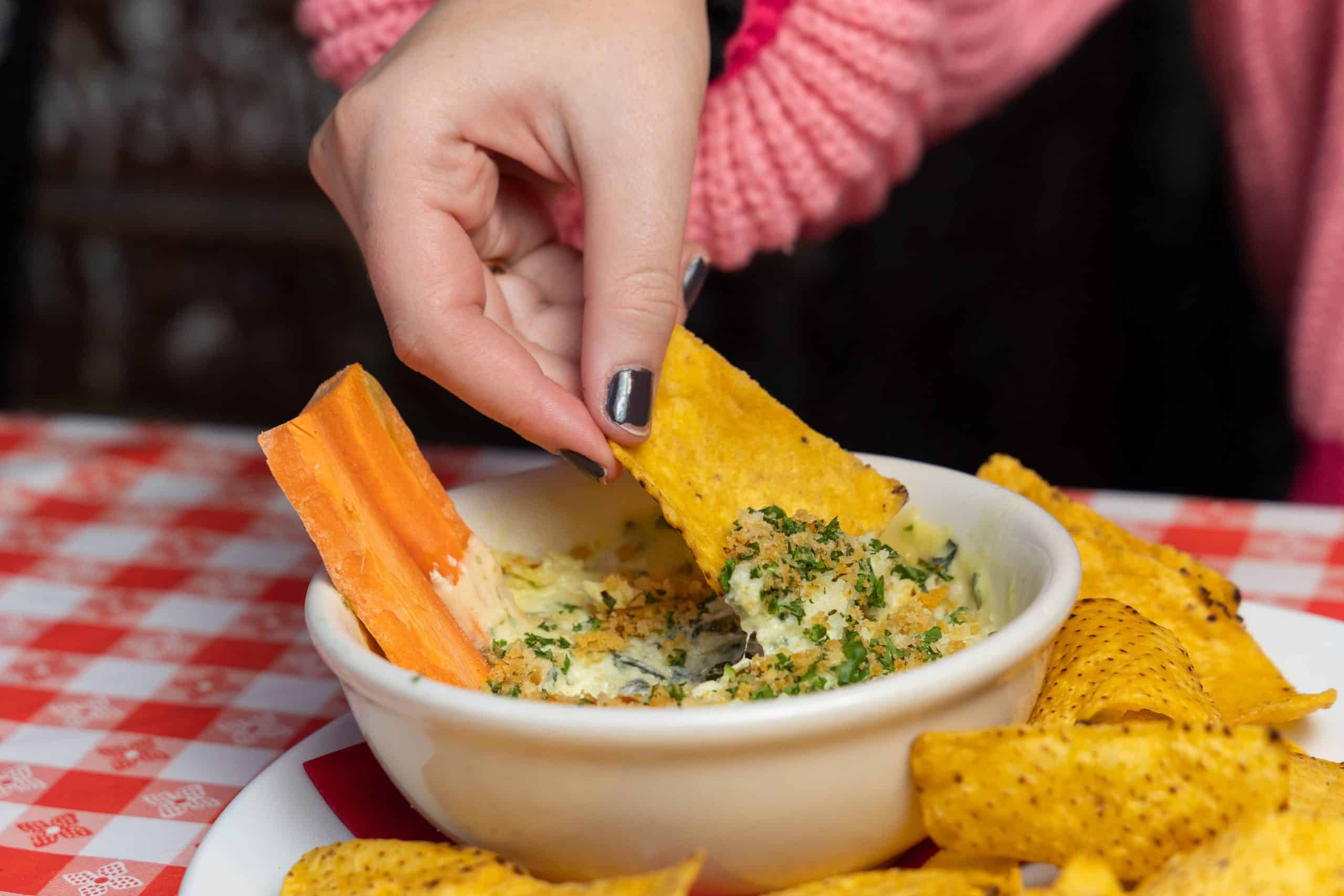 Spinach artichoke dip with tortilla chips at The Comedy Bar