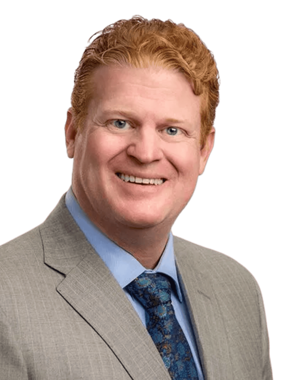 Professional man in a suit smiling for a corporate photo.