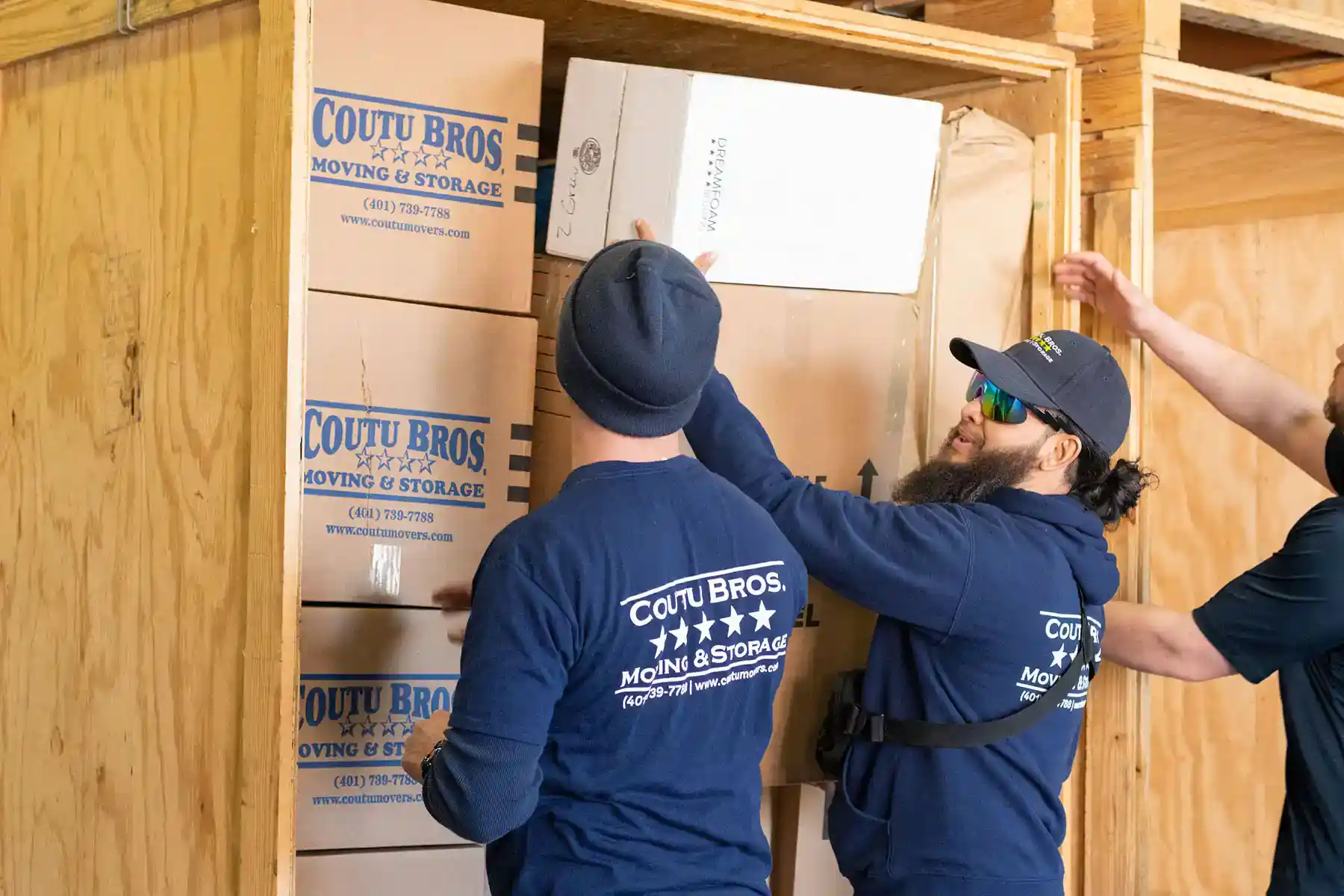 guys from Coutu Movers packing and loading items