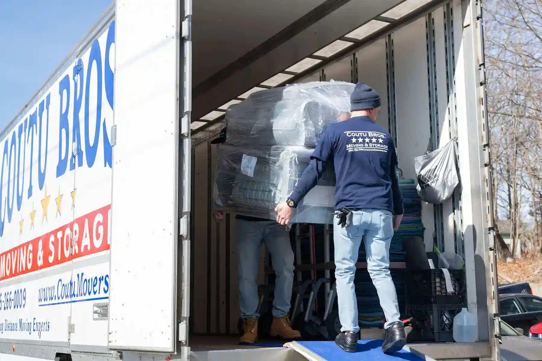 loading designer's furniture into a truck