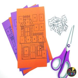 halloween whole class math facts with papers and cards and scissors
