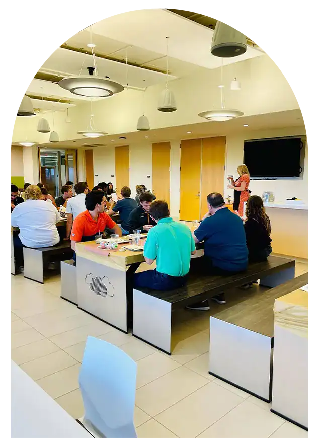 Corporate team building activity with employees engaging in a workshop.