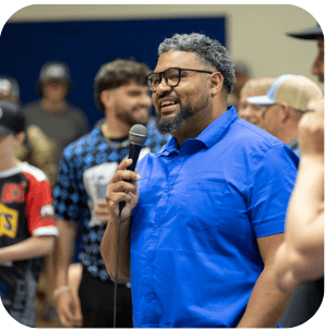 man holding a microphone for child advocacy in Lawrence KS
