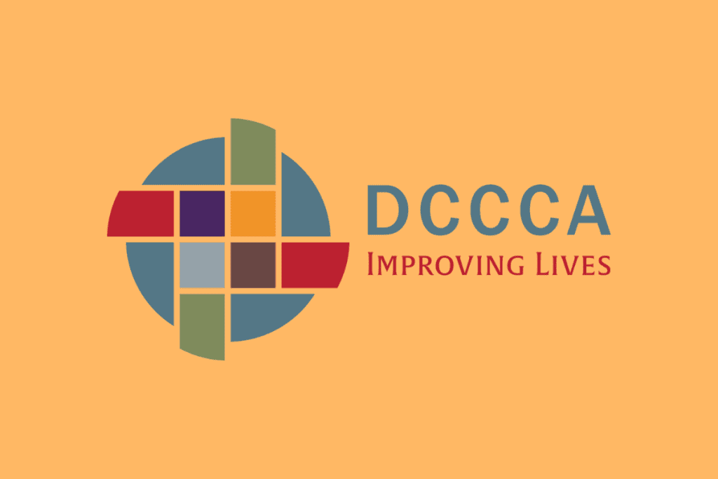 Logo of DCCCA featuring a colorful circular design and the tagline "Improving Lives" on an orange background.