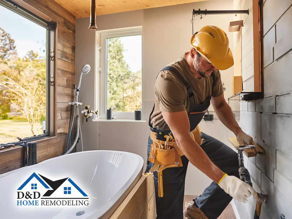 expert bathroom remodeling male professional contractor performing expert residential home remodeling service in bathroom of home