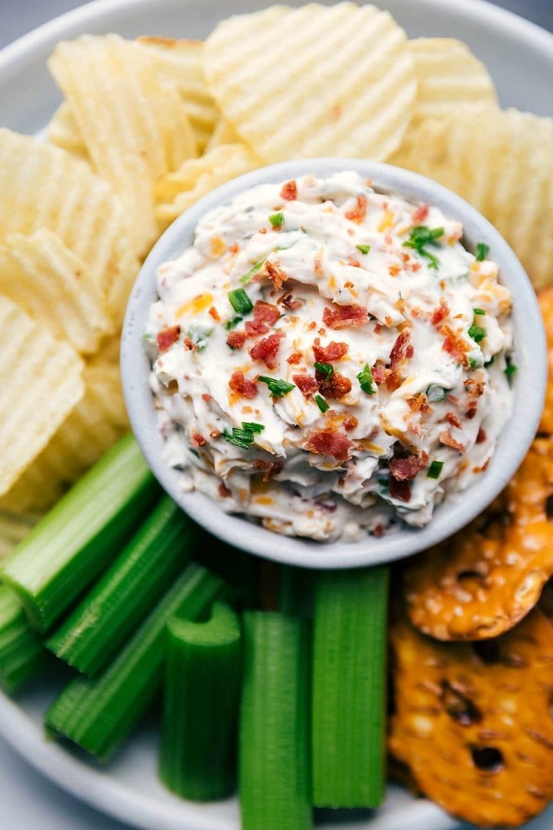 Loaded baked potato dip with bacon, cheddar, and chives.