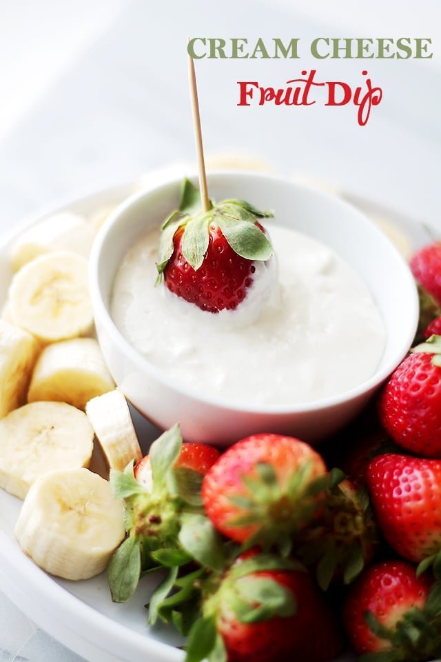Cream cheese fruit dip surrounded by fresh fruit.