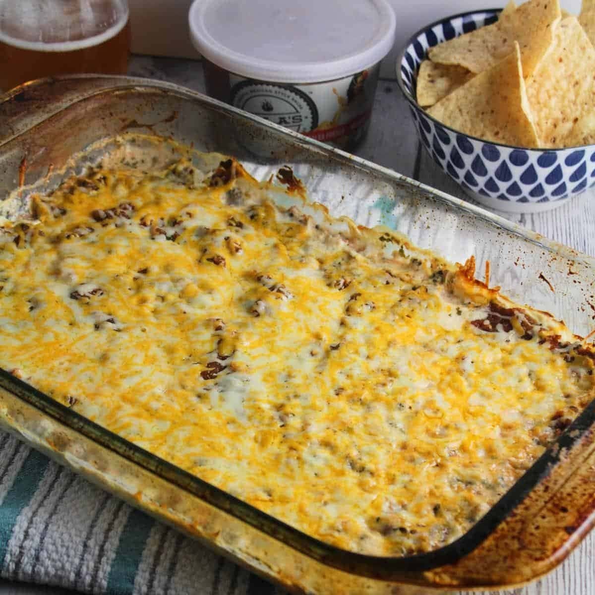 Simple Mexican cream cheese dip layered with salsa and cheese.