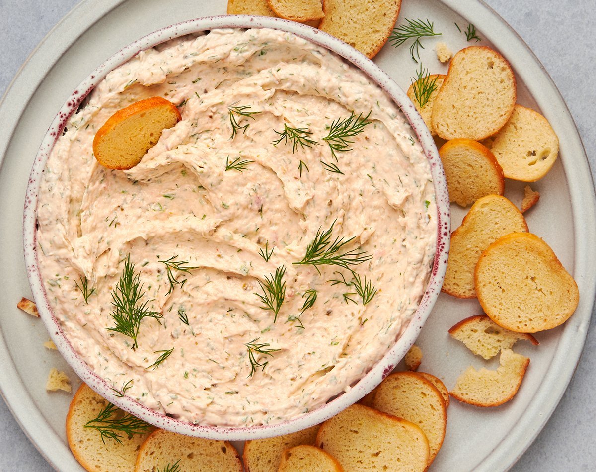 Smoked salmon dip garnished with dill and lemon.