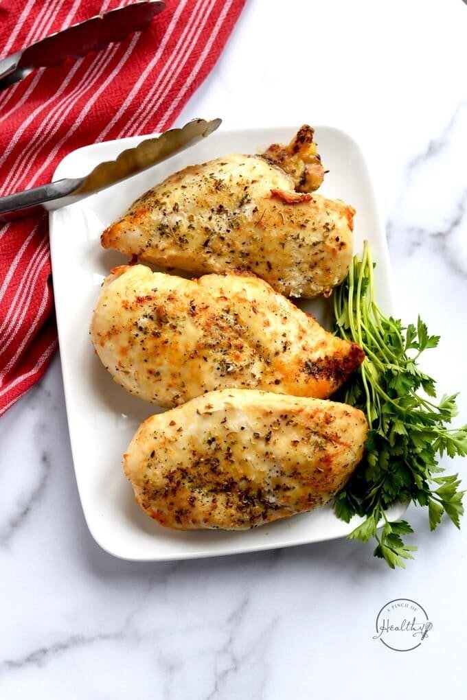 Sliced seasoned chicken breasts cooked in an air fryer