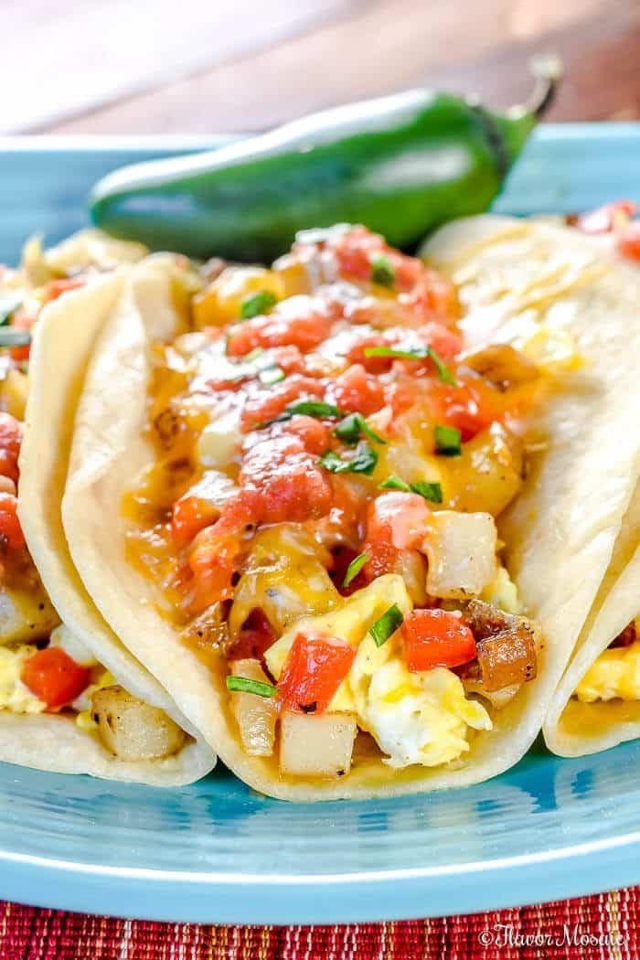 Breakfast tacos with potatoes, eggs, and cheese in tortillas